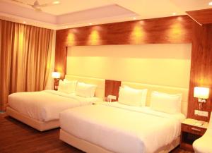 Sarovar Portico, Somnath客房内的一张或多张床位