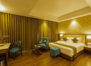 Sarovar Portico, Somnath客房内的一张或多张床位