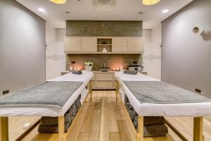 Posteľ alebo postele v izbe v ubytovaní Hanza Pałac Wellness & SPA