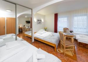 Postel nebo postele na pokoji v ubytování Murena Hotel i Restauracja