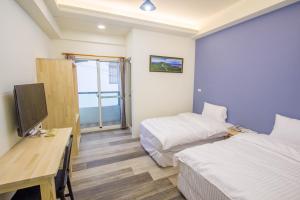 TV a/nebo společenská místnost v ubytování Fantasy Homestay