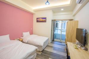 Postel nebo postele na pokoji v ubytování Fantasy Homestay