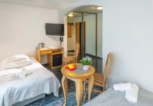Postel nebo postele na pokoji v ubytování Murena Hotel i Restauracja