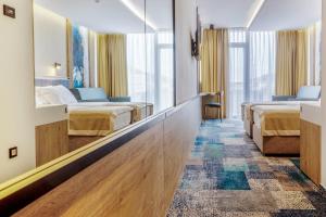 Postel nebo postele na pokoji v ubytování Hotel Sunce Neum
