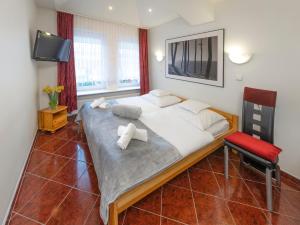 Postel nebo postele na pokoji v ubytování Murena Hotel i Restauracja