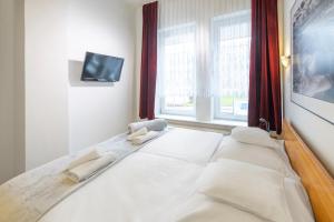 Postel nebo postele na pokoji v ubytování Murena Hotel i Restauracja