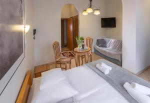 Postel nebo postele na pokoji v ubytování Murena Hotel i Restauracja