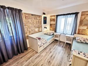 Posteľ alebo postele v izbe v ubytovaní CroBeauty Villa