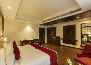 Sarovar Portico, Somnath客房内的一张或多张床位