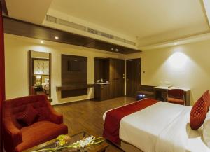 Sarovar Portico, Somnath客房内的一张或多张床位