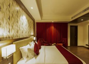 Sarovar Portico, Somnath客房内的一张或多张床位
