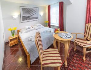 Postel nebo postele na pokoji v ubytování Murena Hotel i Restauracja