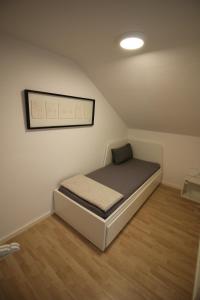 Ένα ή περισσότερα κρεβάτια σε δωμάτιο στο Ferienwohnung Wassermann
