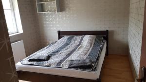 Łóżko lub łóżka w pokoju w obiekcie Nad Morzem