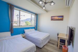 Postel nebo postele na pokoji v ubytování Fantasy Homestay