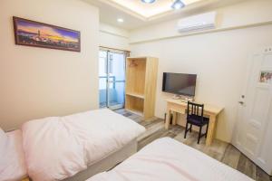 Postel nebo postele na pokoji v ubytování Fantasy Homestay