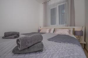 Posteľ alebo postele v izbe v ubytovaní Apartmani Kecman