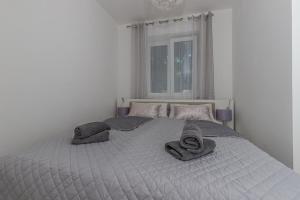 Posteľ alebo postele v izbe v ubytovaní Apartmani Kecman