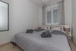 Posteľ alebo postele v izbe v ubytovaní Apartmani Kecman