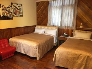 Postel nebo postele na pokoji v ubytování Sun Moon Lake Tan Hsiang Yu B&B