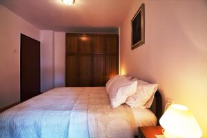 Postel nebo postele na pokoji v ubytování MONTE Beach Apartments