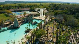 an aerial view of a water park with a slide at Hotel Clipper - EL DELFÍN VERDE RESORTS - Platja de Pals in Torroella de Montgrí