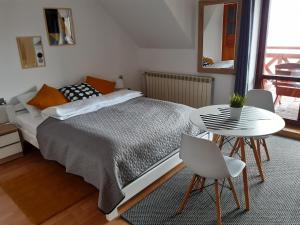 Postel nebo postele na pokoji v ubytování O.W. MEGA nad jeziorem