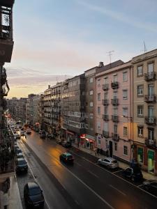 a view of a city street with cars and buildings at Zuni Guest House in Lisbon