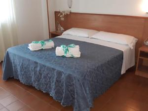 Postel nebo postele na pokoji v ubytování Hotel Leuco'
