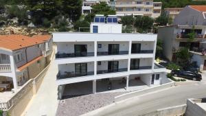 an aerial view of a white building at Libar Studio Apartments in Baška Voda