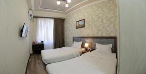 Katil atau katil-katil dalam bilik di ARK BILLUR HALAL Hotel by HotelPro Group