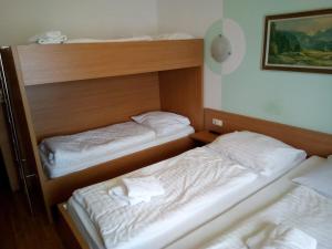 Postel nebo postele na pokoji v ubytování Torrenerhof