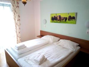 Postel nebo postele na pokoji v ubytování Torrenerhof