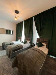 מיטה או מיטות בחדר ב-Hotel Bellavista Deta