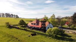 an aerial view of a house in a field at Ubytování Na prženských pasekách in Mikulŭvka