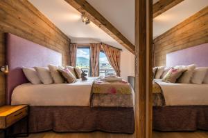 Postel nebo postele na pokoji v ubytování Ozigo penthouse Les Gets - by EMERALD STAY