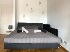 a bedroom with a bed with two pillows on it at NEW STUDIO@Baroque City Center in Dresden