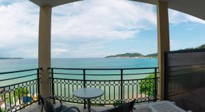 a balcony with a view of the ocean at Hotel Villa Nisteri in Limenas