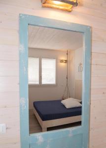 Postel nebo postele na pokoji v ubytování MARINA PONENTE