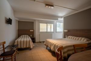 Ένα ή περισσότερα κρεβάτια σε δωμάτιο στο L'Ocean