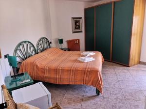 Letto o letti in una camera di B&B La Terrazza