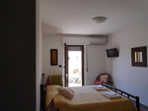 Letto o letti in una camera di B&B La Terrazza