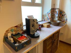 a kitchen counter with a mixer on top of it at Camere Frangimare in Porto Recanati