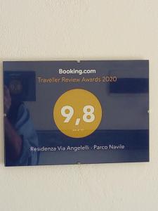 um bilhete para um cartão de recompensas Travelocity com um número amarelo em Residenza Gavioli Via Angelelli - Parco Navile em Castel Maggiore