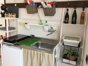 Kuchyň nebo kuchyňský kout v ubytování Green Corner Gelsomino