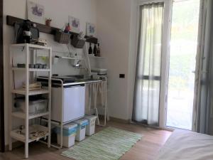 Kuchyň nebo kuchyňský kout v ubytování Green Corner Gelsomino