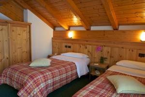 Voodi või voodid majutusasutuse Hotel Nordik toas