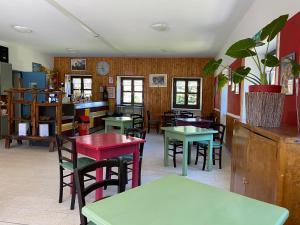 a restaurant with tables and chairs in a room at Chalet della Luna ATTENZIONE lavori di ristrutturazione in corso IMPALCATURA in Claviere