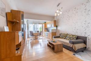 a living room with a couch and a table at Apartman Lana in Baška