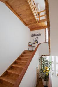 a staircase in a house with wooden ceilings at Je T'aime Porto Sweet Rooms in Vila Nova de Gaia +101 photos